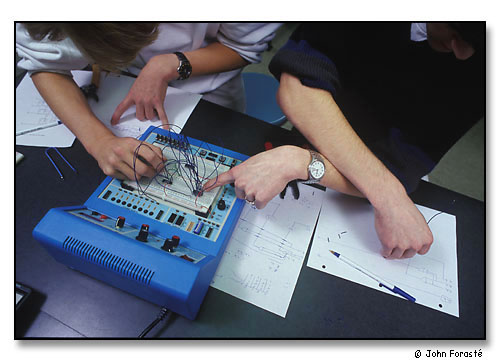 Students working together on electronic circuit. <br>During Math/Science Day for visiting high school students. <br>Wheaton College, Norton, Massachusetts. November 1999.