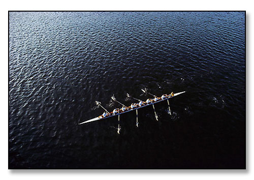 The men's crew of Brown University at end of race against Boston University. <br>Seekonk River, Providence, Rhode Island. April 1983.