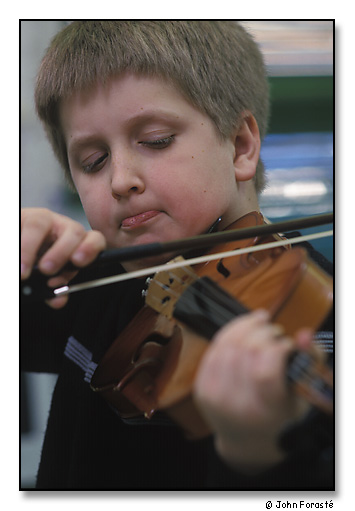 >James Marcil, a Community MusicWorks' student during violin lesson. <br>The West End Community Center, Providence, Rhode Island. April 2002.
