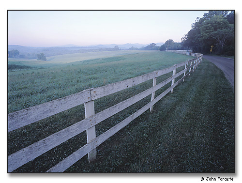 Fence and field, Greene County, Virginia. In the distance, the Blue Ridge Mountains of Shenandoah National Park.