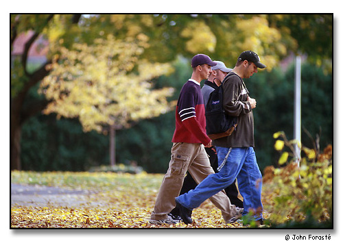 Three students between class on beautiful fall day. <br>Wheaton College, Norton, Massachusetts. November 1999.
