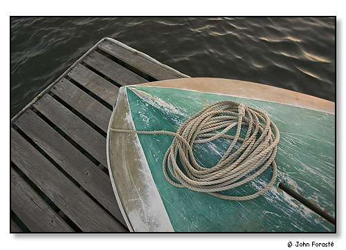 Boat on dock near sunset. Westport River, Westport, Massachusetts. August 2004.