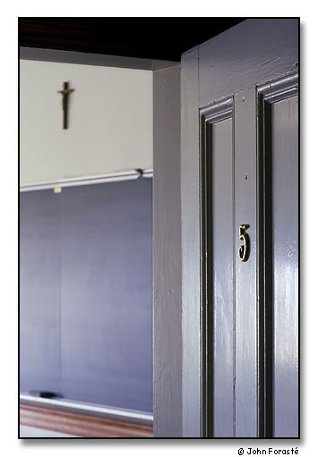 College classroom with crucifix. <br>Alumni Hall, Saint Anselm College, Manchester, New Hampshire. May 2002.